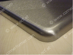 ACF finished corner of a table plate in stainless steel
